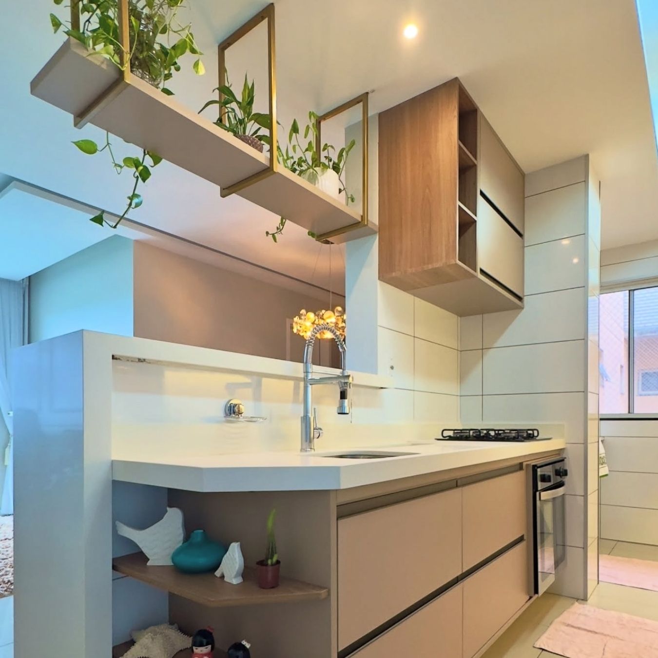 Compact kitchen with brass planter shelves