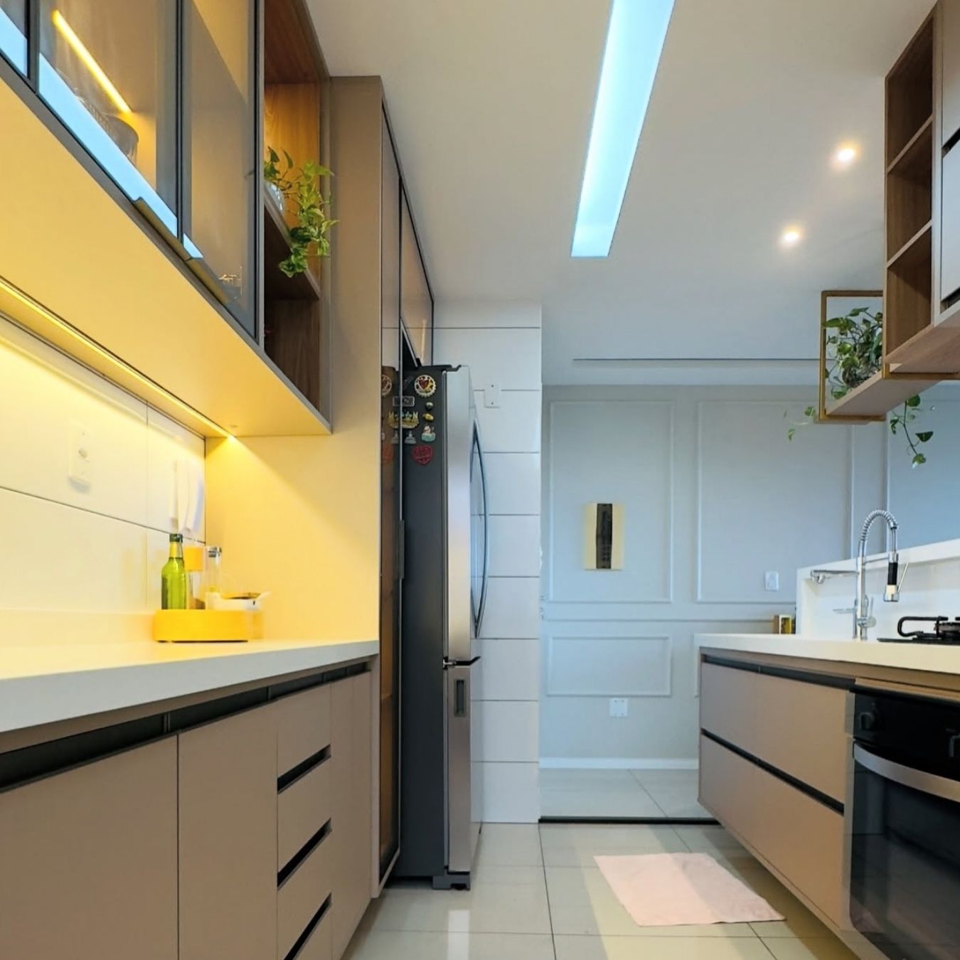 Galley kitchen with LED-lit uppers