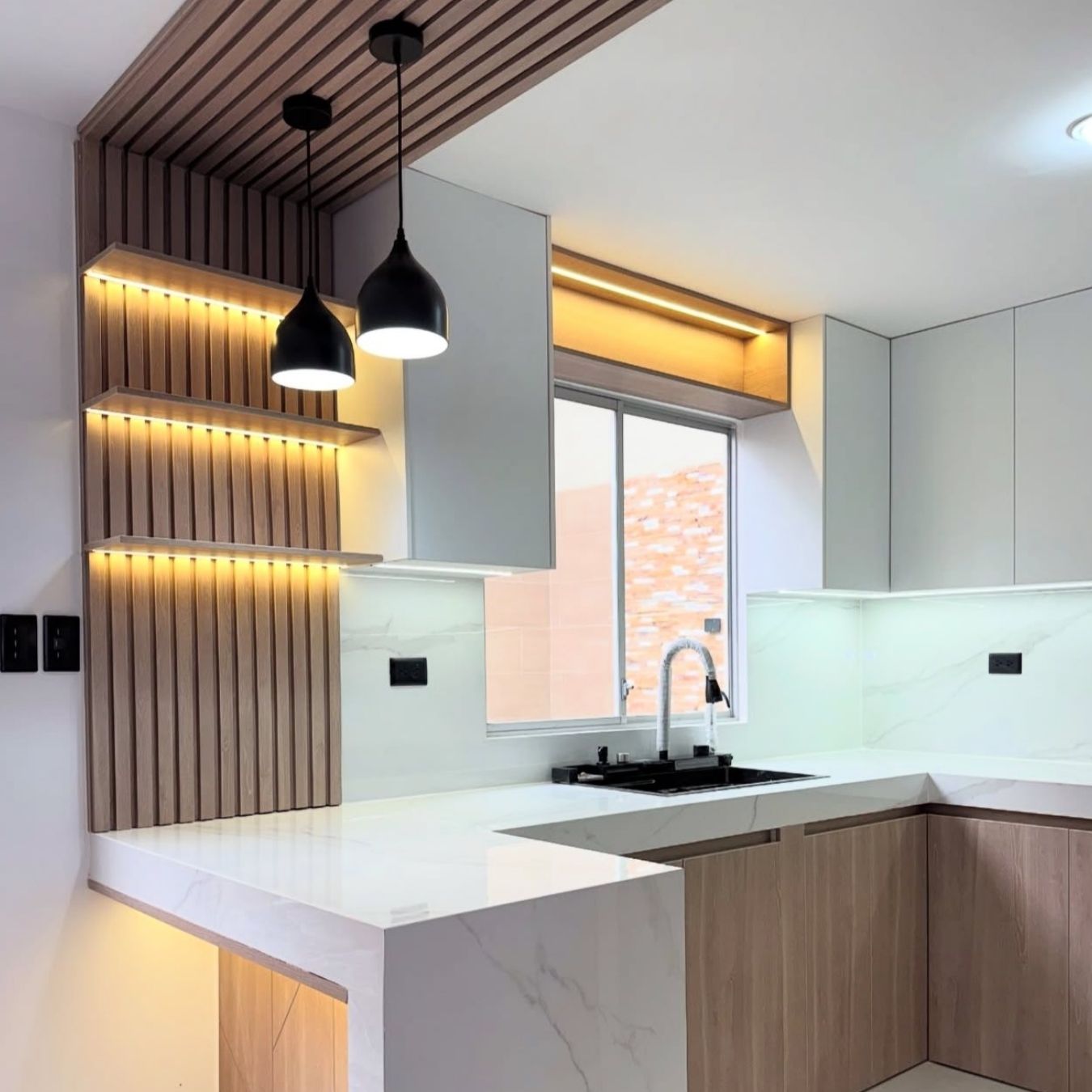 Modern kitchen with slatted feature wall & pendants