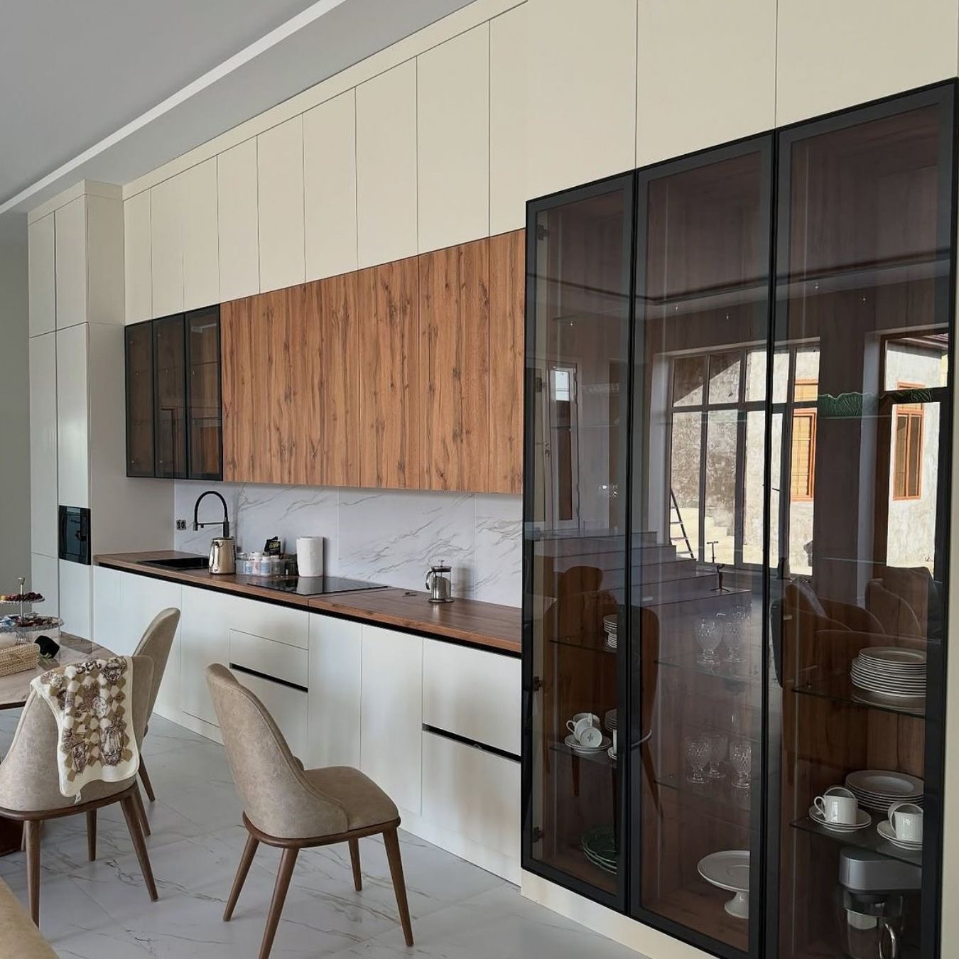 Walnut & cream kitchen with tall display cabinet