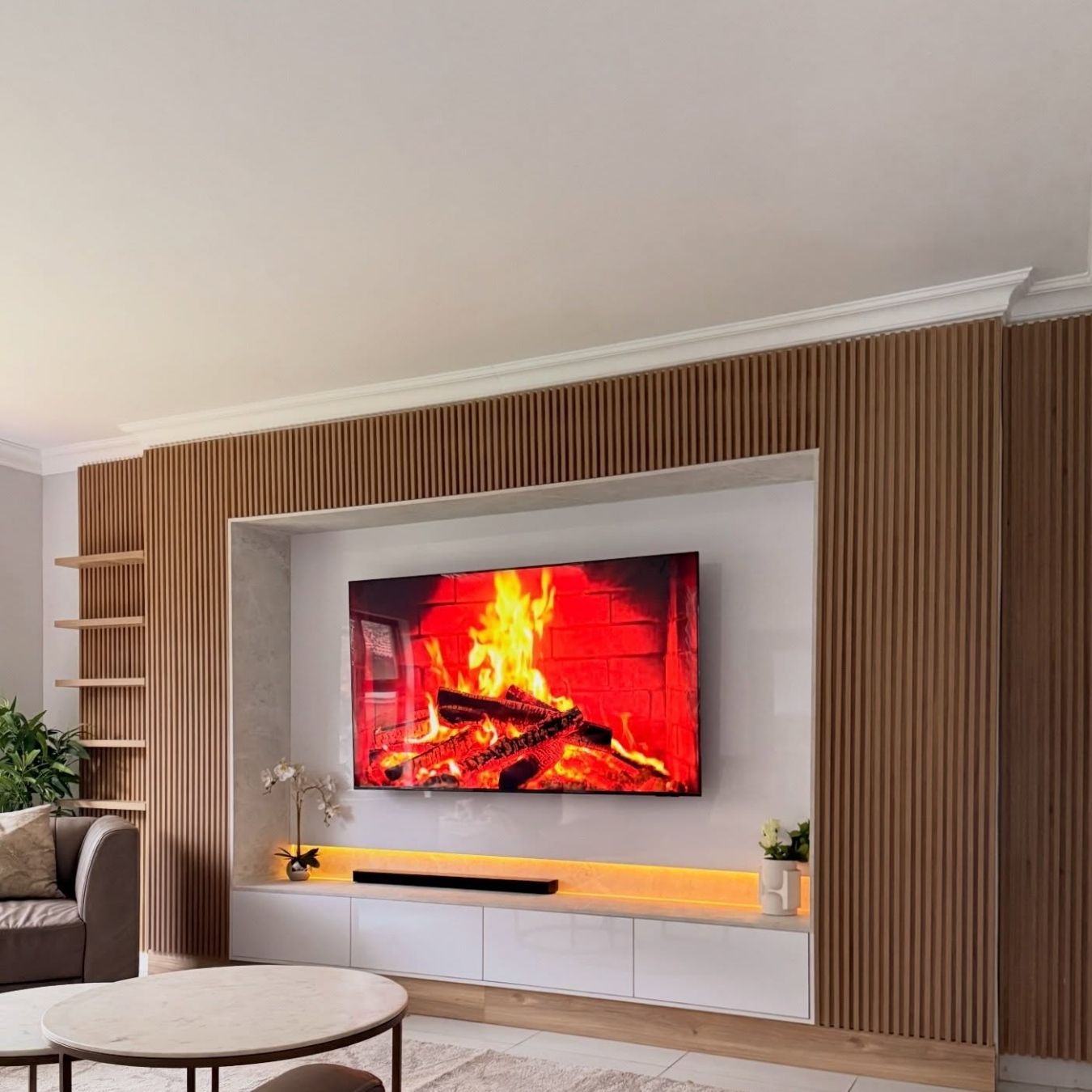 Lights on, screen mounted — a clean media wall, fully integrated and ready to enjoy.