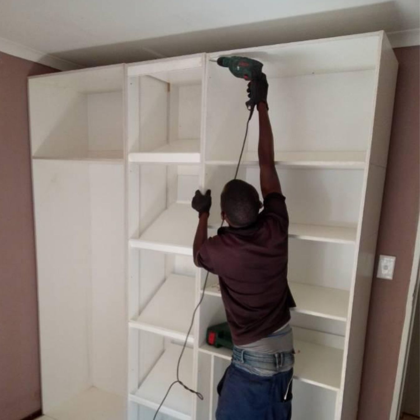 Custom shelving build in progress on site